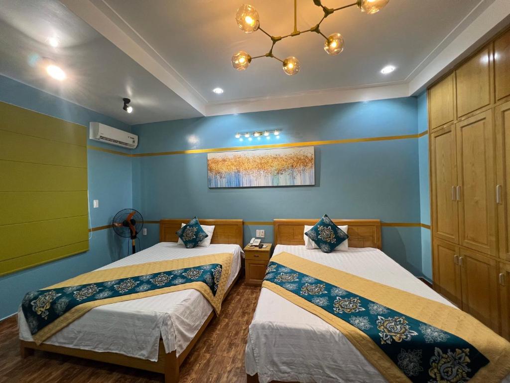 מיטה או מיטות בחדר ב-Kim Dung Ha Long