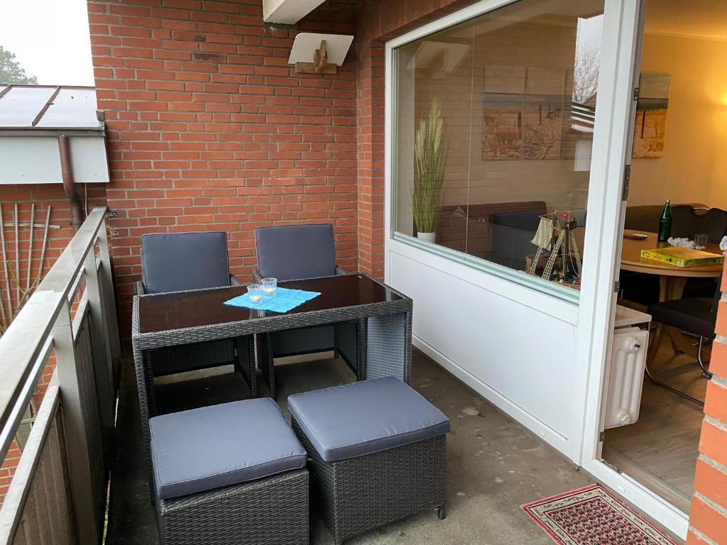 Posezení v ubytování Amrumer Schatztruhe mit Loggia und Meerblick