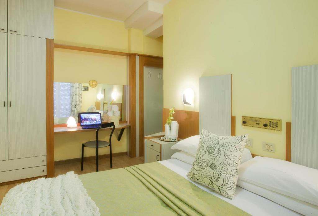Postel nebo postele na pokoji v ubytování Hotel Bel Air