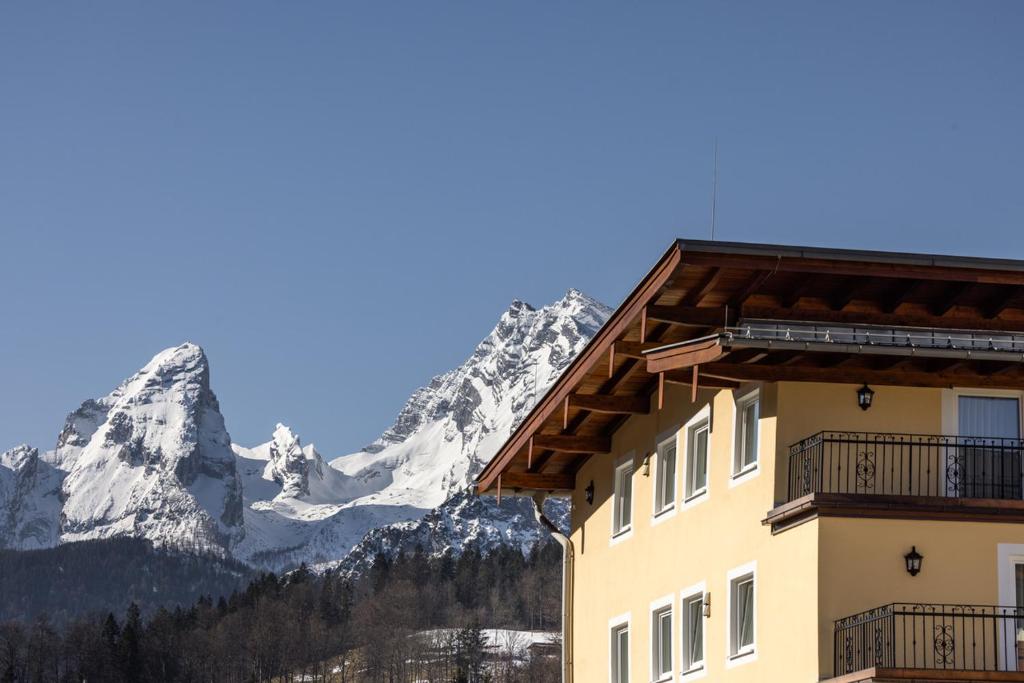 a snowy mountain with a mountain range at Hotel Schwabenwirt in Berchtesgaden