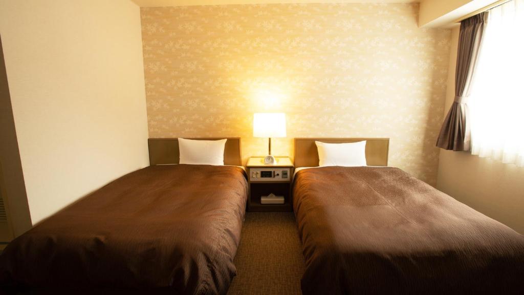 Postel nebo postele na pokoji v ubytování Hotel Yassa
