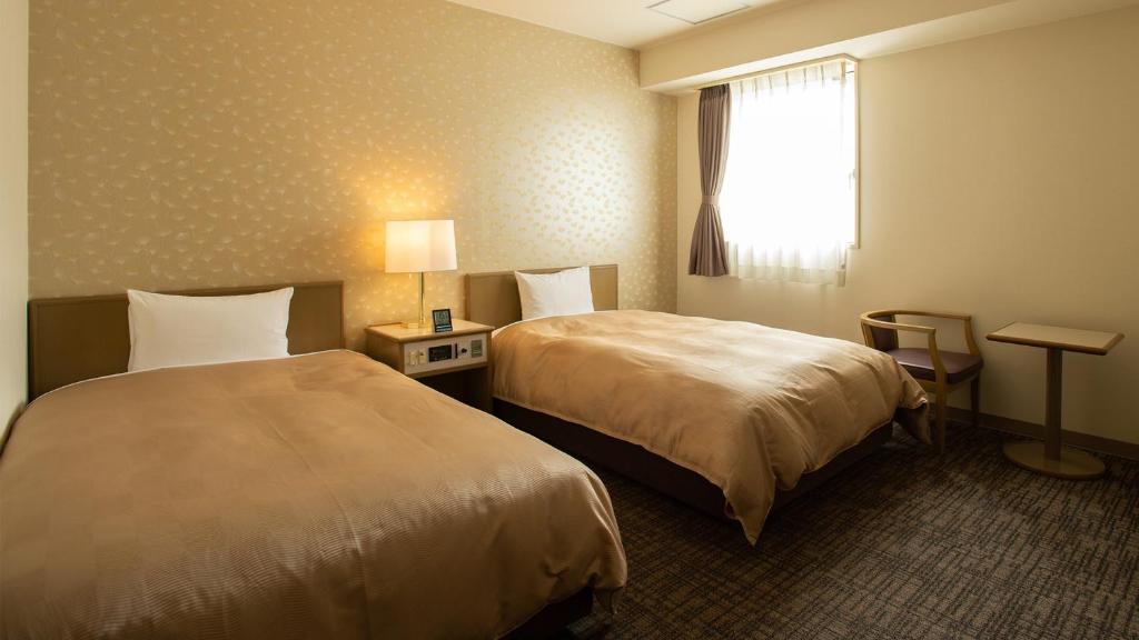 Postel nebo postele na pokoji v ubytování Hotel Yassa