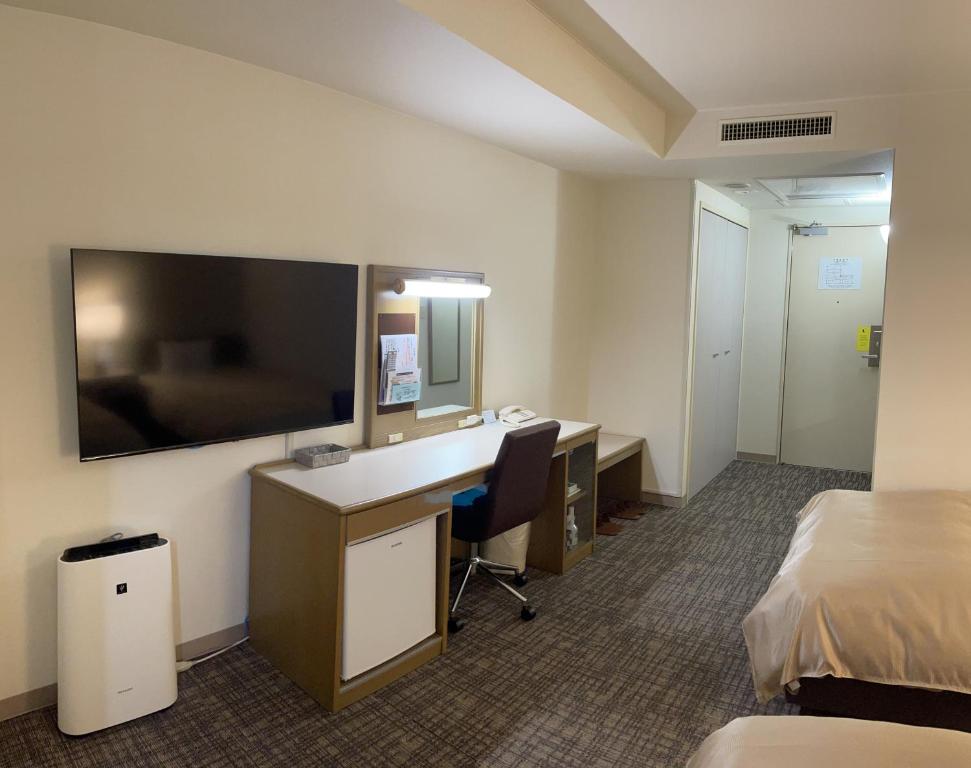 TV a/nebo společenská místnost v ubytování Hotel Yassa