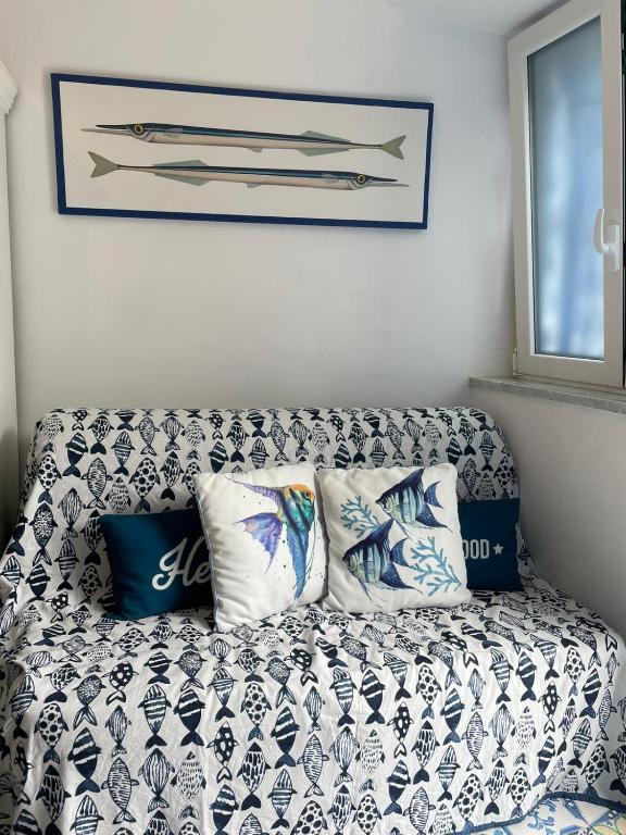 A bed or beds in a room at Petit Maison Jeranto