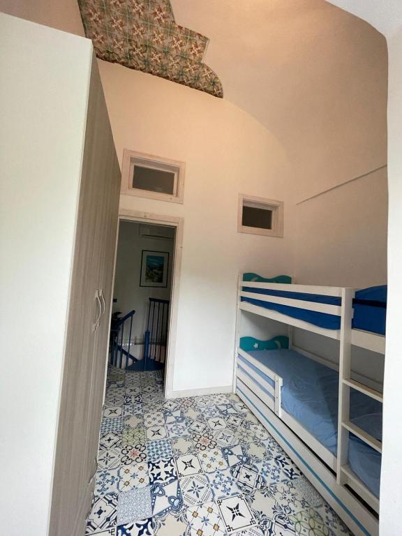 A bed or beds in a room at Petit Maison Jeranto