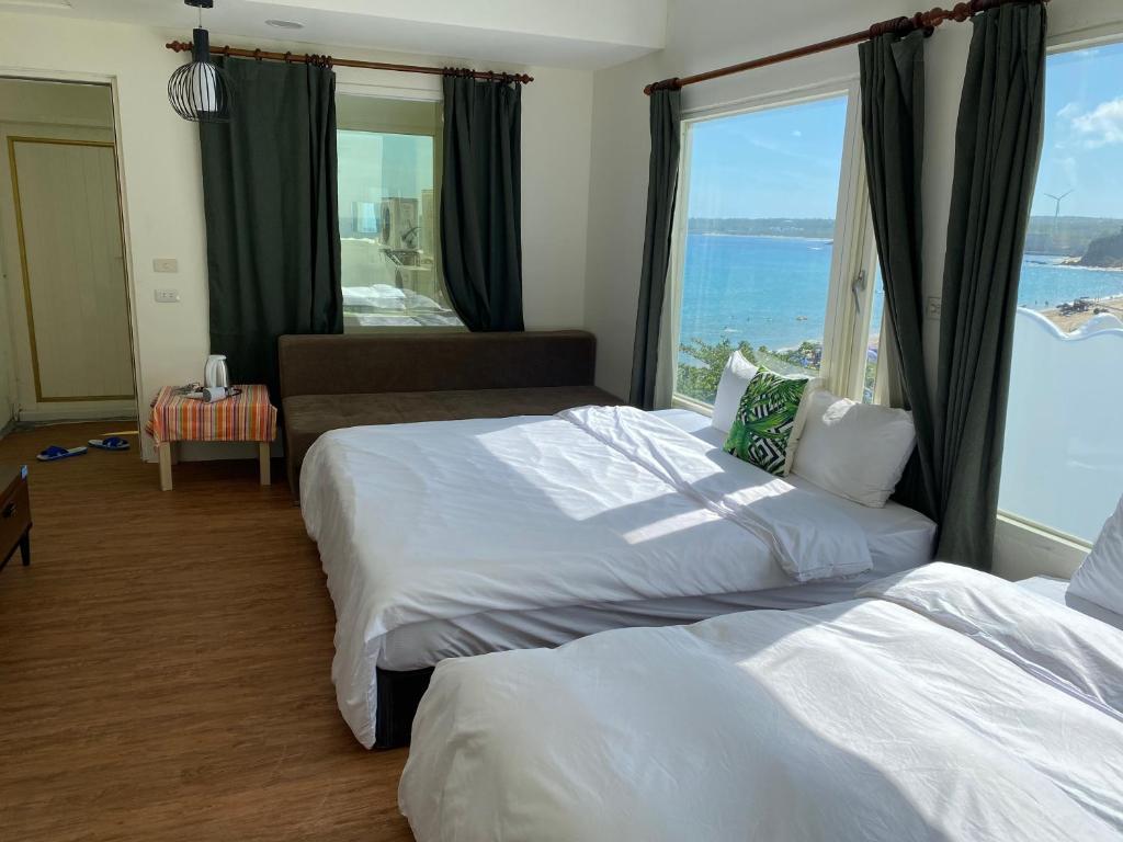 Postel nebo postele na pokoji v ubytování Hearty Homestay