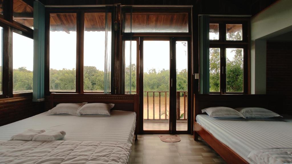 Postel nebo postele na pokoji v ubytování Homestay Dat Viet