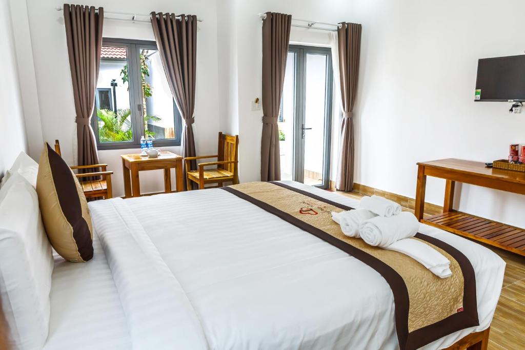 Postel nebo postele na pokoji v ubytování Rainforest Resort Phu Quoc