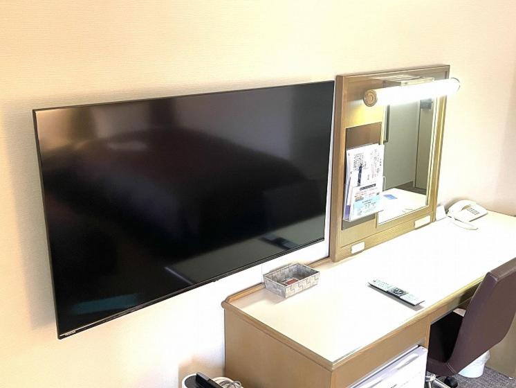 TV a/nebo společenská místnost v ubytování Hotel Yassa