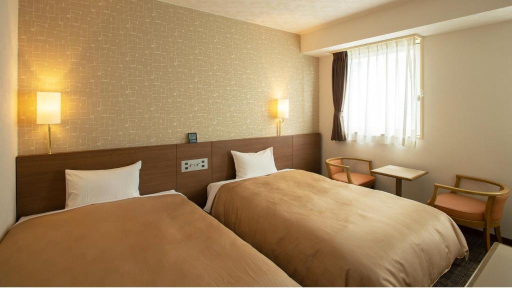 Postel nebo postele na pokoji v ubytování Hotel Yassa