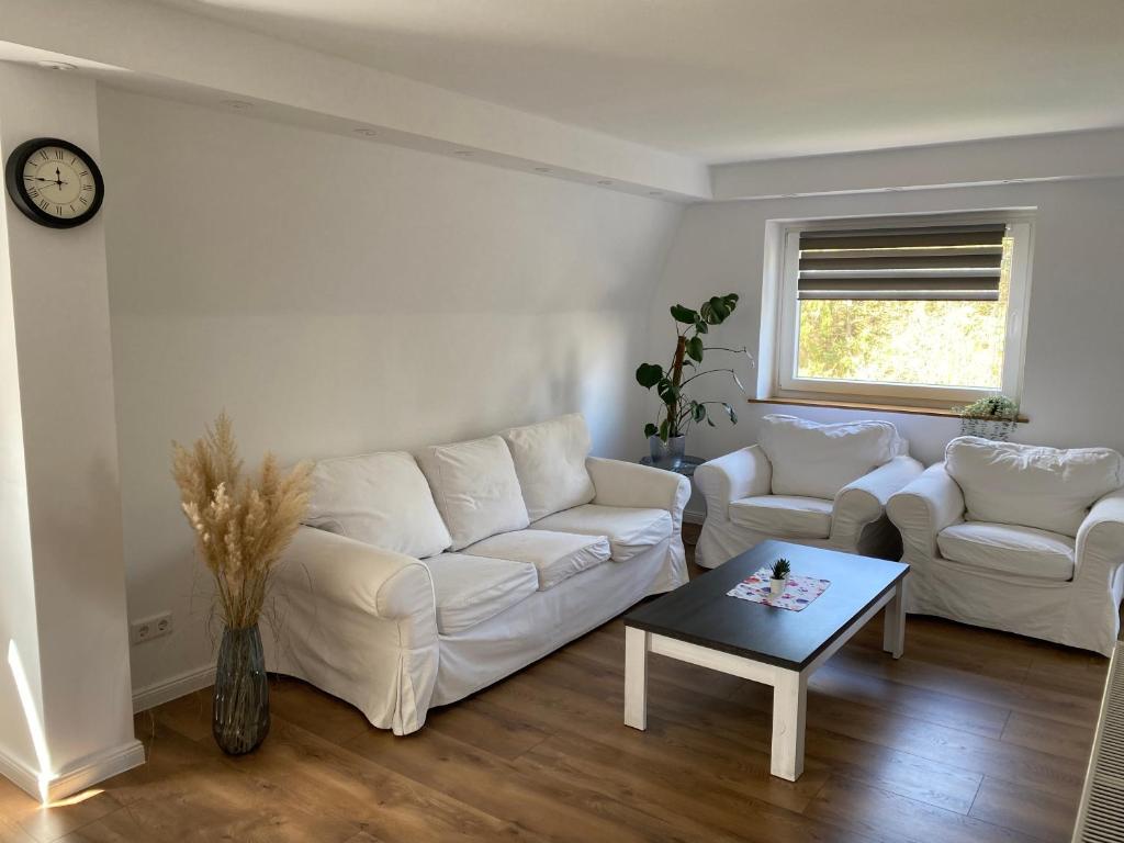 Гостиная зона в Ferienwohnung mit Balkon und Garten OG