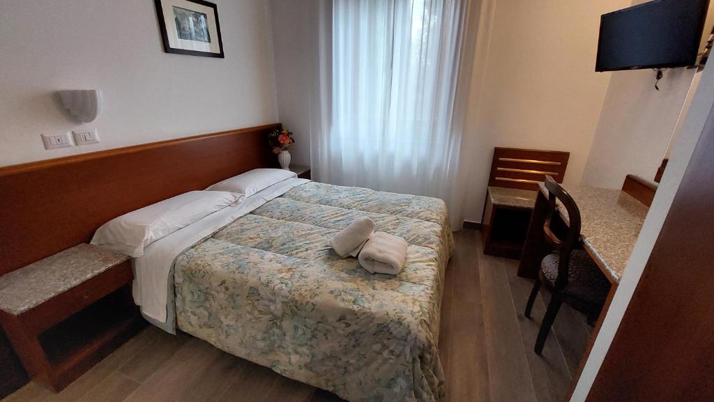 Postel nebo postele na pokoji v ubytování Hotel Villalago trasimeno