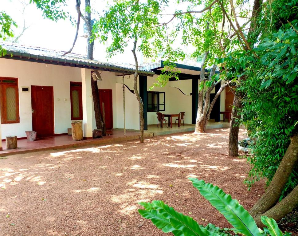 an outside view of a house with a patio at Nugasewana Guest in Anuradhapura