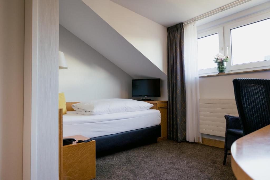 Postel nebo postele na pokoji v ubytování DOM Hotel LIMBURG