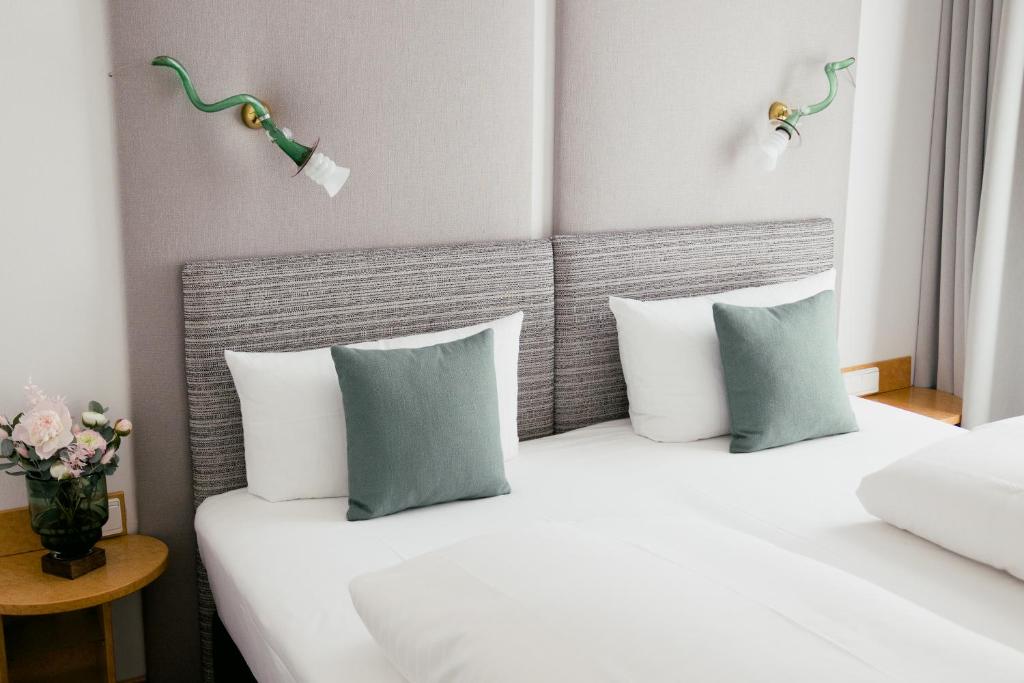 Postel nebo postele na pokoji v ubytování DOM Hotel LIMBURG
