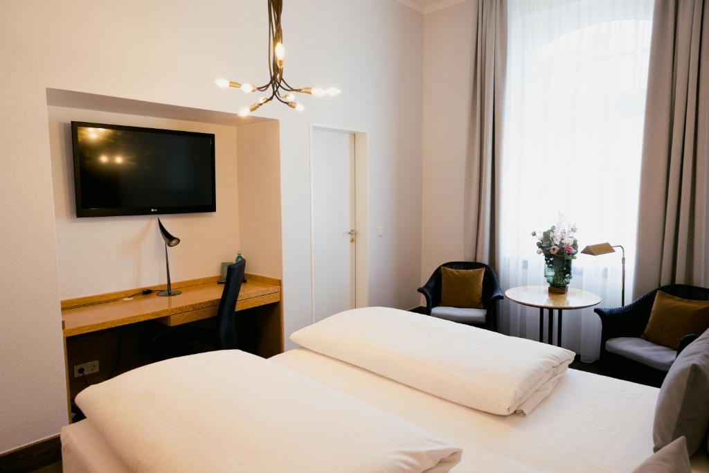 Postel nebo postele na pokoji v ubytování DOM Hotel LIMBURG