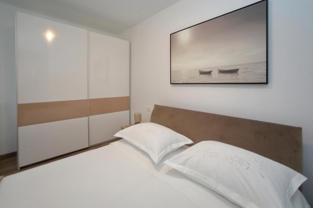 Postel nebo postele na pokoji v ubytování Apartment Alfonso