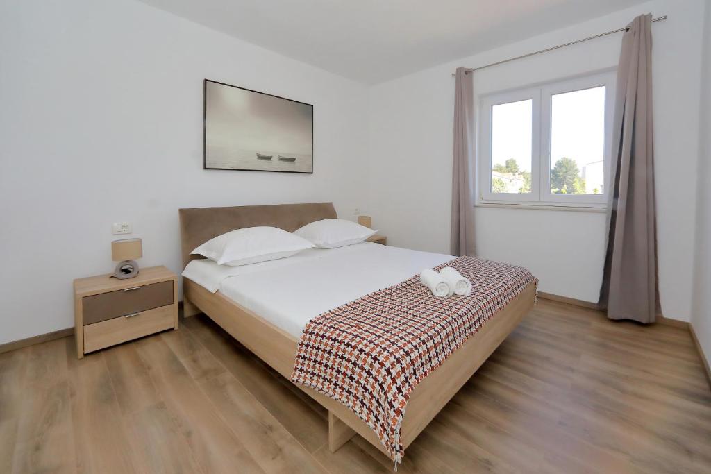 Postel nebo postele na pokoji v ubytování Apartment Alfonso