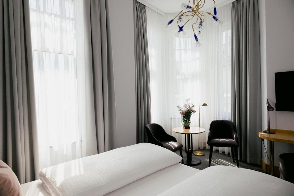 Postel nebo postele na pokoji v ubytování DOM Hotel LIMBURG