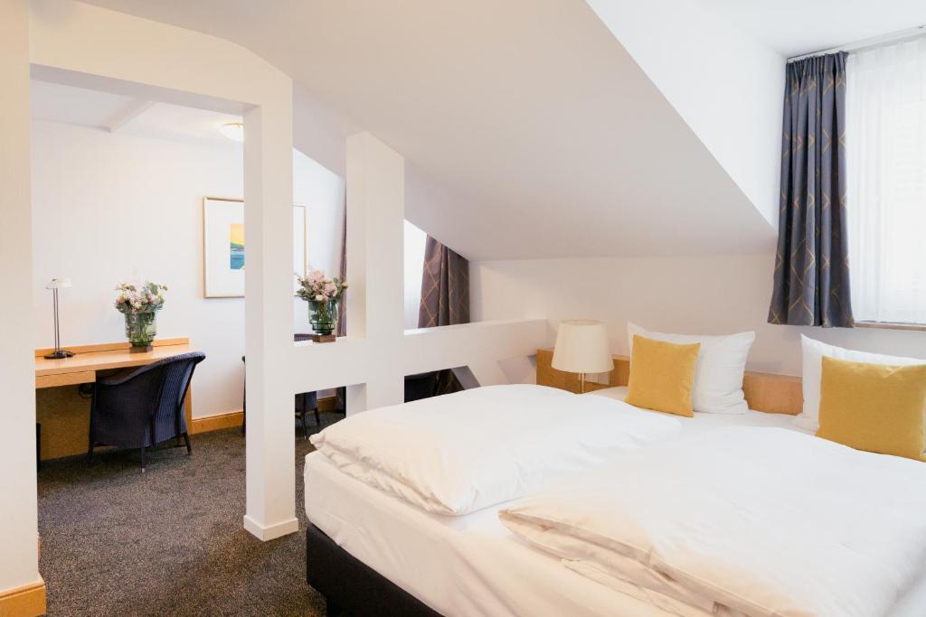 Postel nebo postele na pokoji v ubytování DOM Hotel LIMBURG