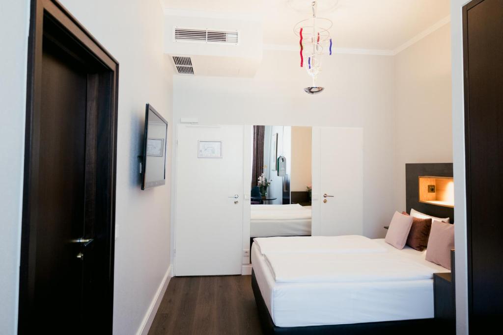Postel nebo postele na pokoji v ubytování DOM Hotel LIMBURG