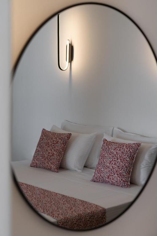 Postel nebo postele na pokoji v ubytování Asha Luxury Suites