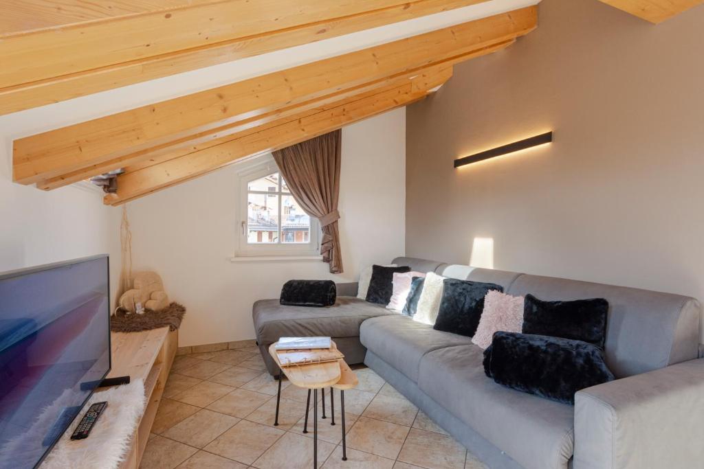 TV a/nebo společenská místnost v ubytování Attico Faloria Luxury