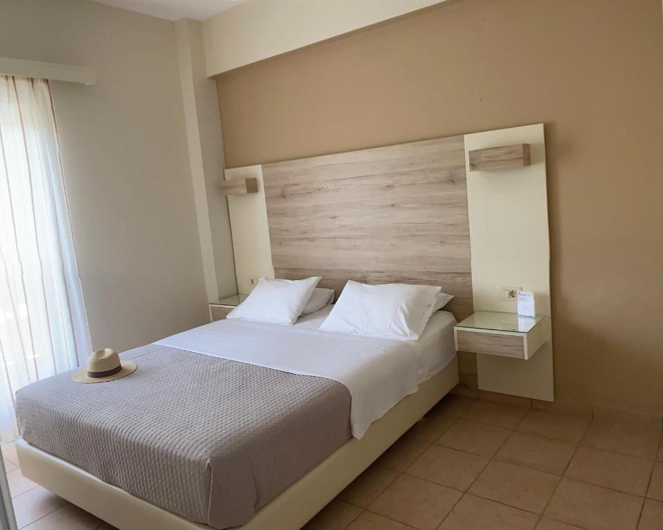 Postel nebo postele na pokoji v ubytování Poseidon Studios & Apartments