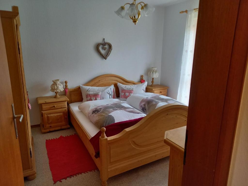 Postel nebo postele na pokoji v ubytování Ferienwohnung Bayrischzell