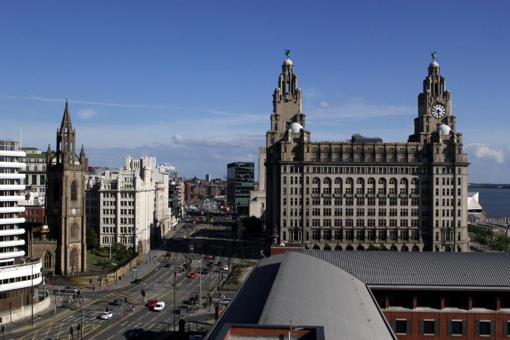 a view of a city with buildings and a street at Liver View Apartments in Liverpool