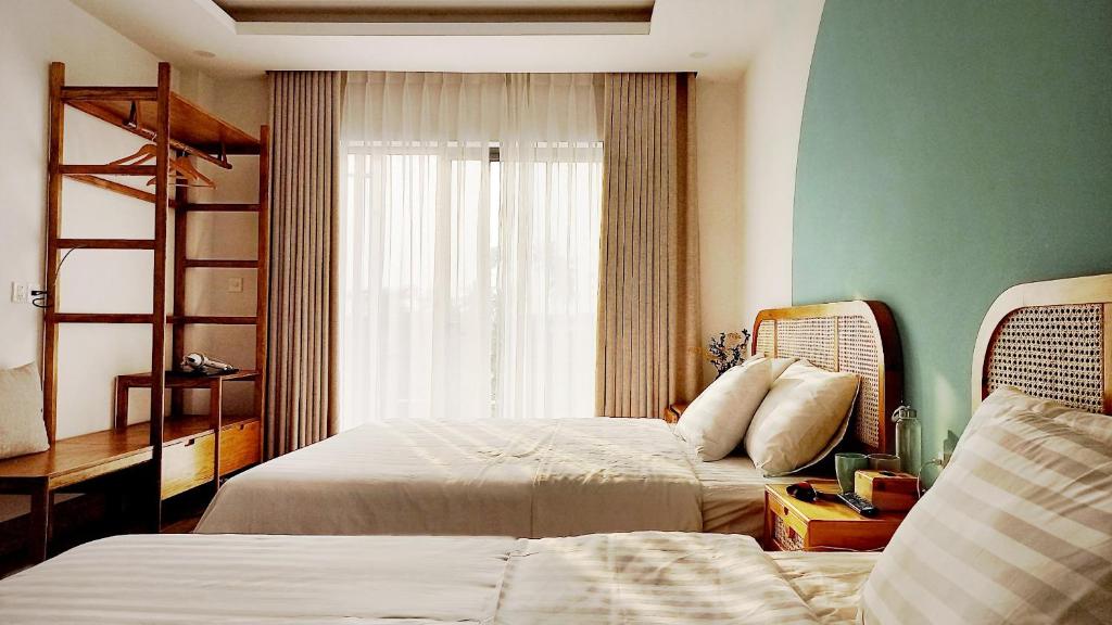Postel nebo postele na pokoji v ubytování Lacovy Home Hội An