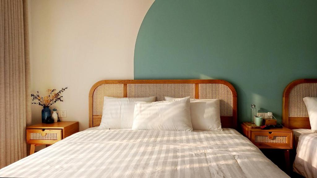 Postel nebo postele na pokoji v ubytování Lacovy Home Hội An