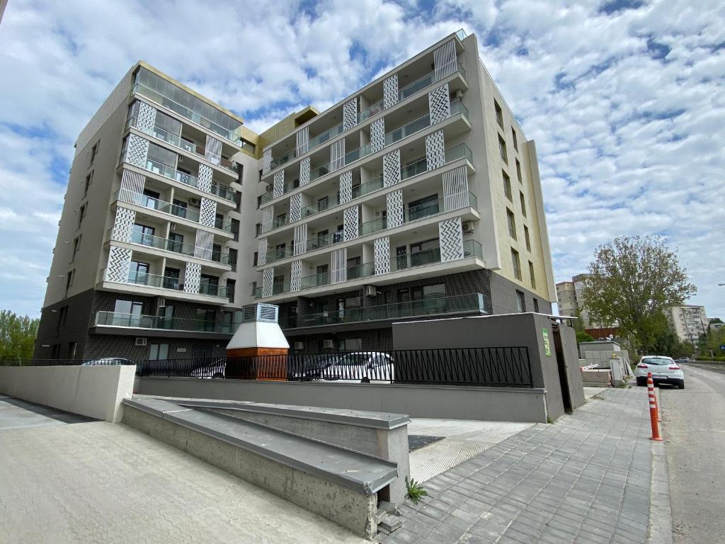 a large apartment building on the side of a street at Apartament Park View Campus in Constanţa