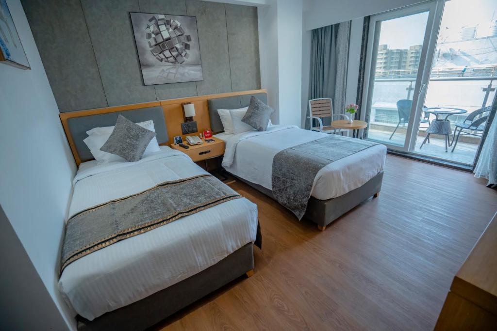 Postel nebo postele na pokoji v ubytování Zip By Spree Hotels Chakan, Pune
