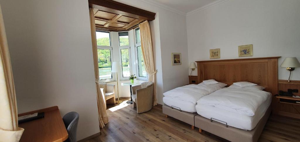 Postel nebo postele na pokoji v ubytování Hotel Schön
