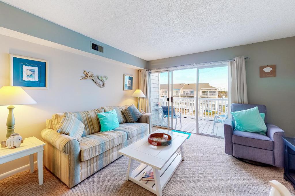 a living room with a couch and a table at Hidden Harbour 312C in Ocean City