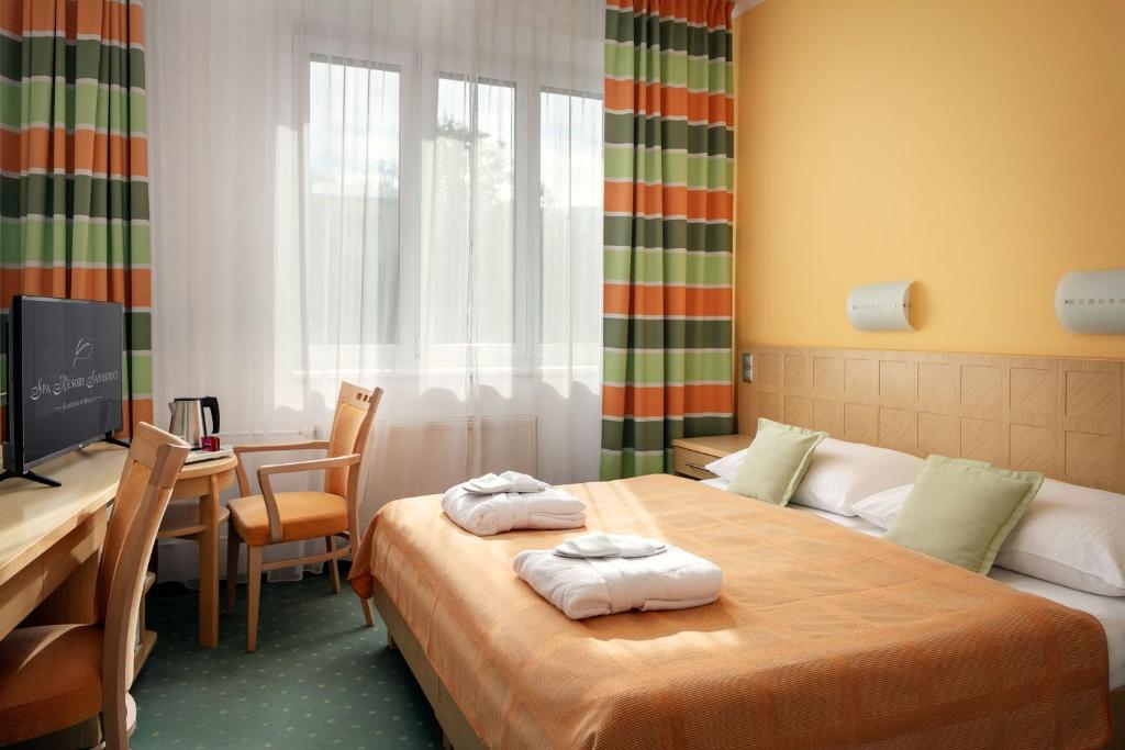 Postel nebo postele na pokoji v ubytování Spa Resort Sanssouci