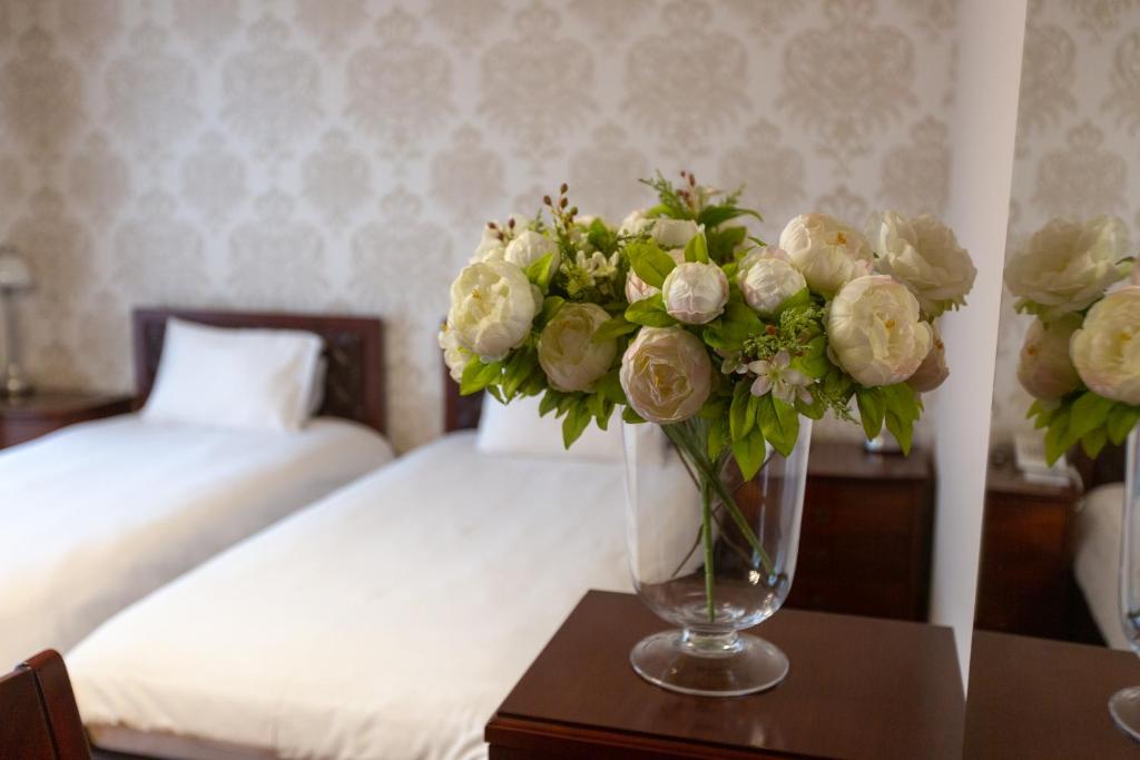 Postel nebo postele na pokoji v ubytování Latar Hotel Yerevan