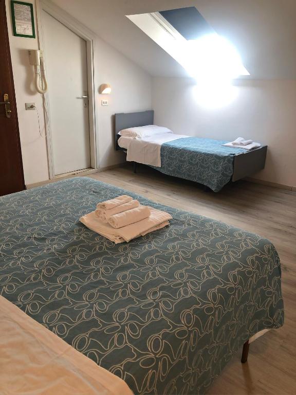 Postel nebo postele na pokoji v ubytování Hotel del Falco