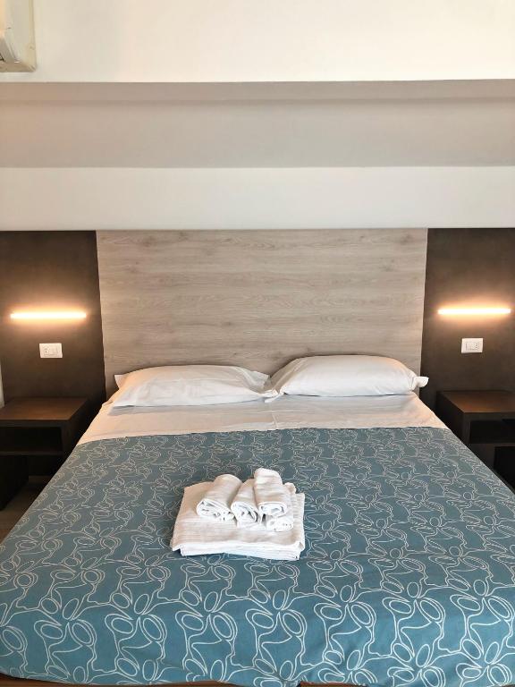 Postel nebo postele na pokoji v ubytování Hotel del Falco