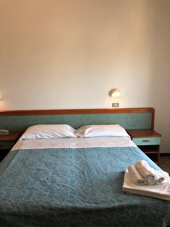 Postel nebo postele na pokoji v ubytování Hotel del Falco