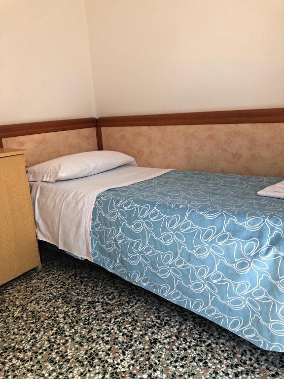 Postel nebo postele na pokoji v ubytování Hotel del Falco