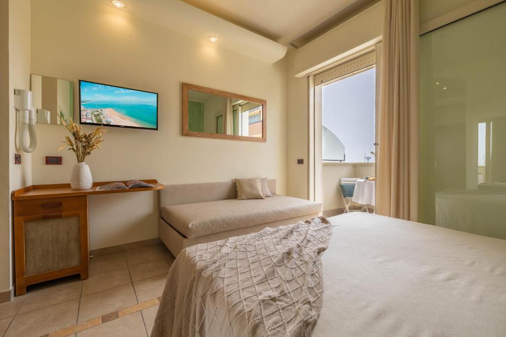 Postel nebo postele na pokoji v ubytování Hotel Smeraldo