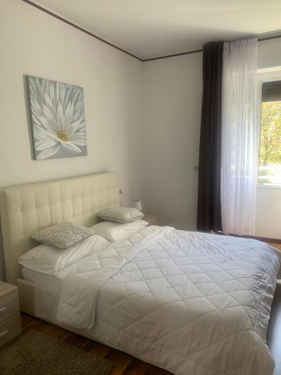 Postel nebo postele na pokoji v ubytování Albergo al lago