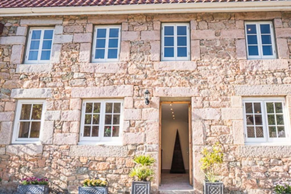 a stone house with a door in front of it at 2 Westview in St. Brelade