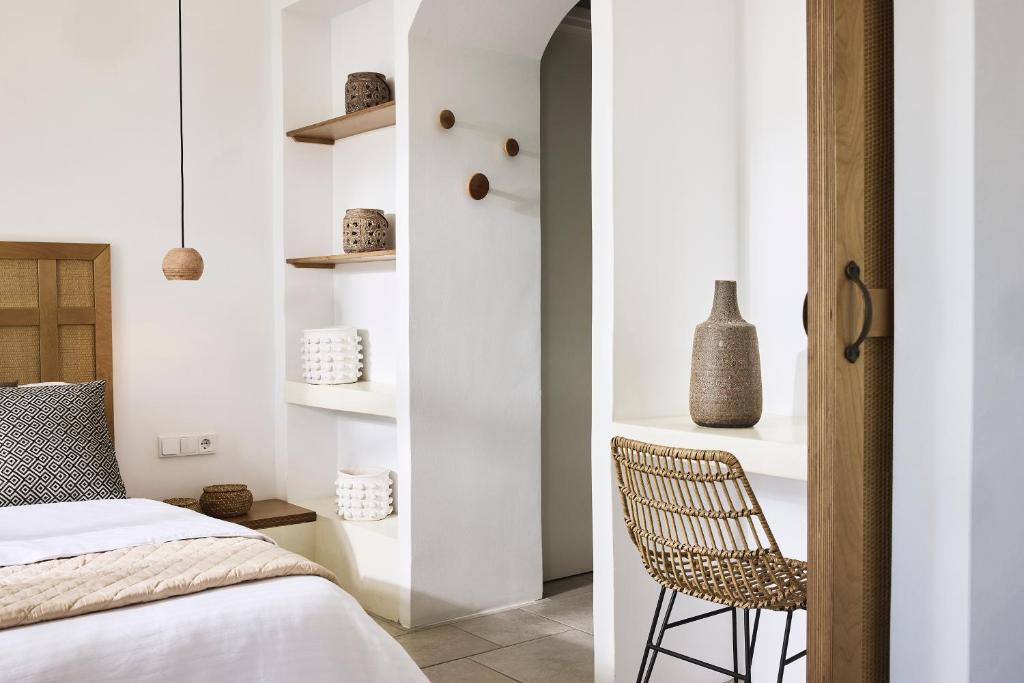 Łóżko lub łóżka w pokoju w obiekcie Antamoma Suites
