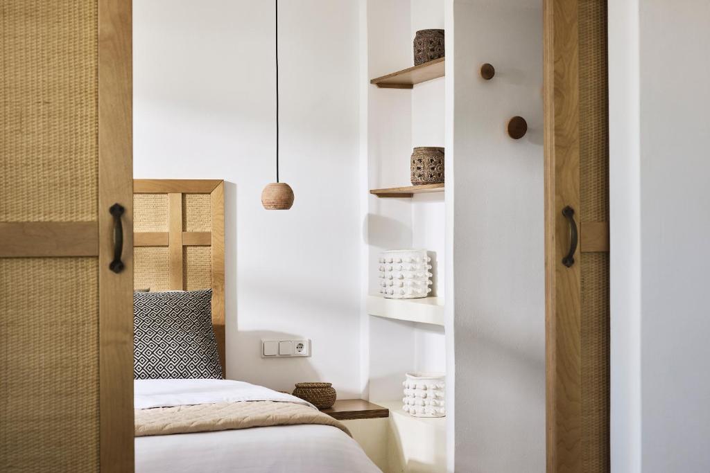 Łóżko lub łóżka w pokoju w obiekcie Antamoma Suites
