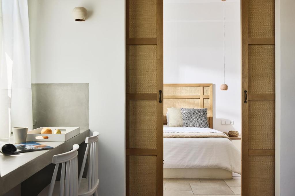 Łóżko lub łóżka w pokoju w obiekcie Antamoma Suites