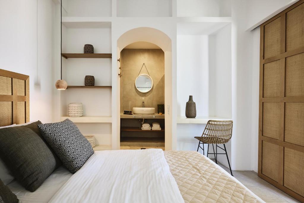 Łóżko lub łóżka w pokoju w obiekcie Antamoma Suites