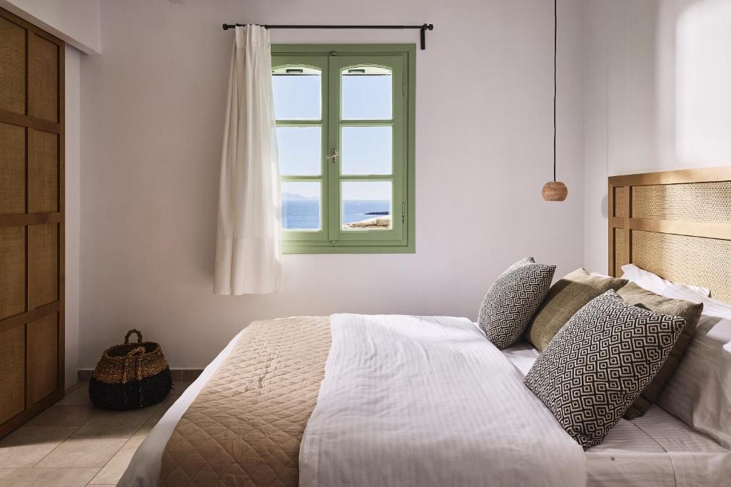 Łóżko lub łóżka w pokoju w obiekcie Antamoma Suites